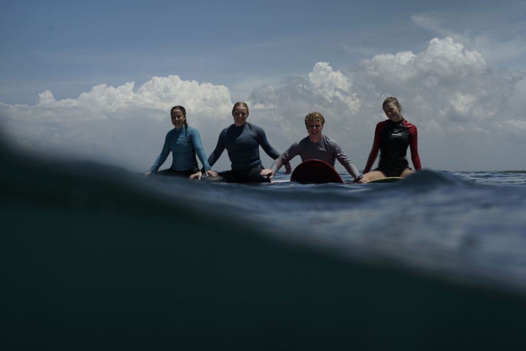 A learner enjoying safe baby padang surf at one of the best beginner surf spots uluwatu.