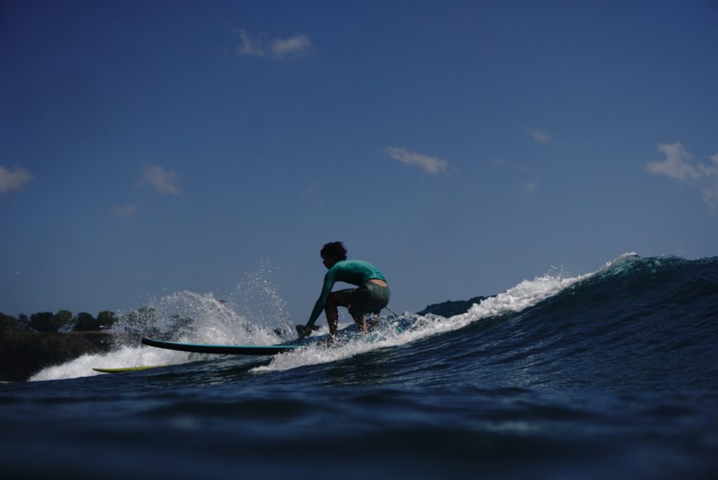 Balangan Beach (All Levels) - Surf Journey Bali Man enjoy learning riding the Balangan Beach wave with Surf Journey Bali