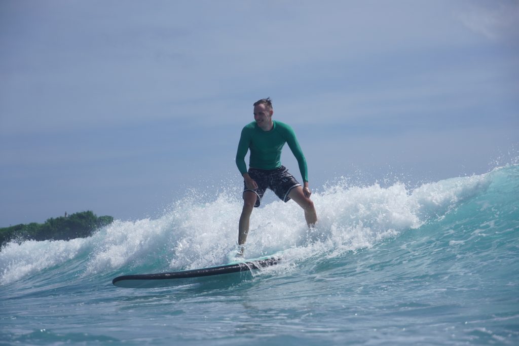 Balangan beach surf beginners - Surf Journey Bali A happy student enjoying a session for balangan beach surf beginners with Surf Journey Bali.